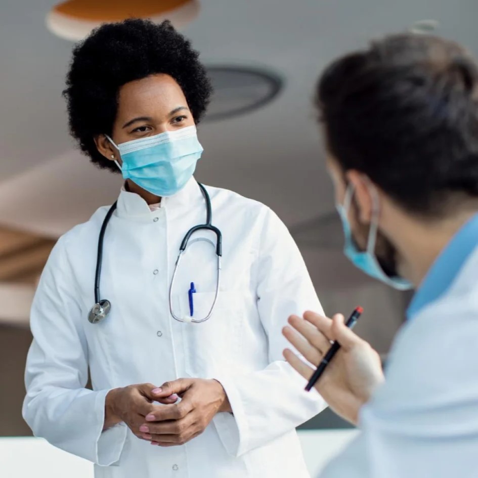 Healthcare professional speaking with a patient