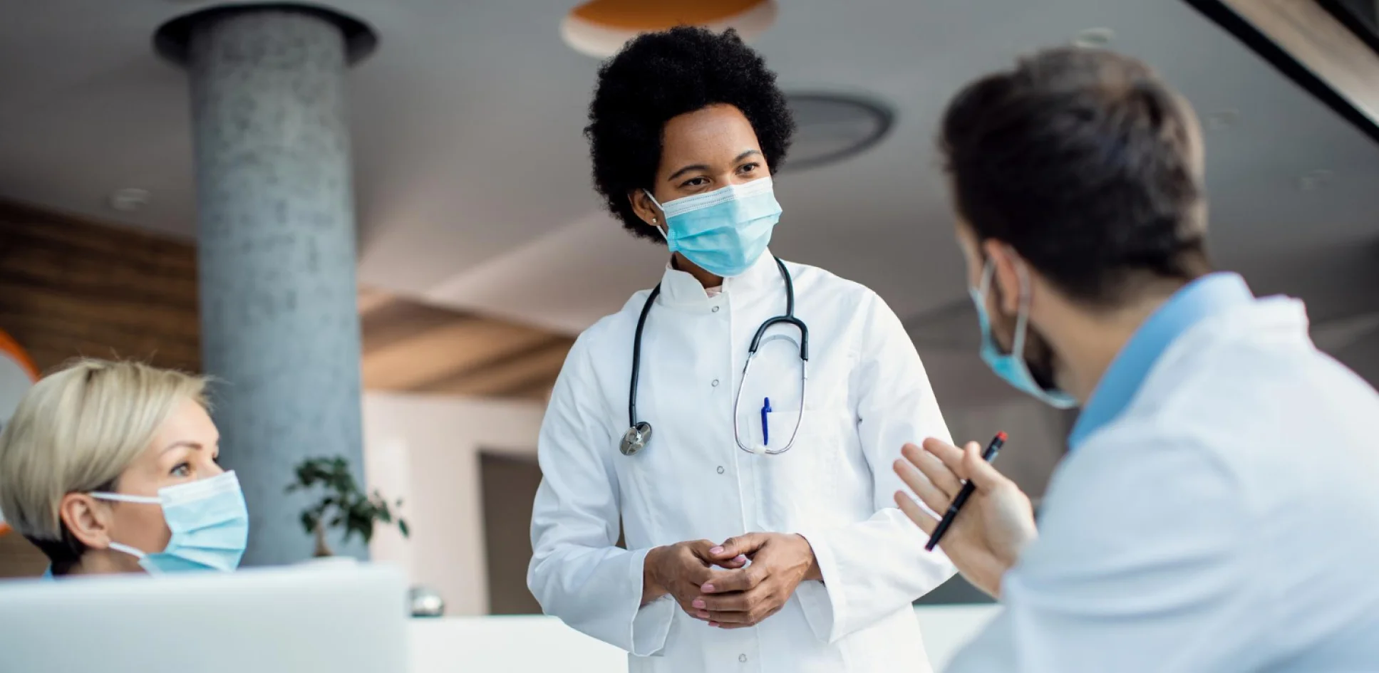 Medical provider speaking with a patient